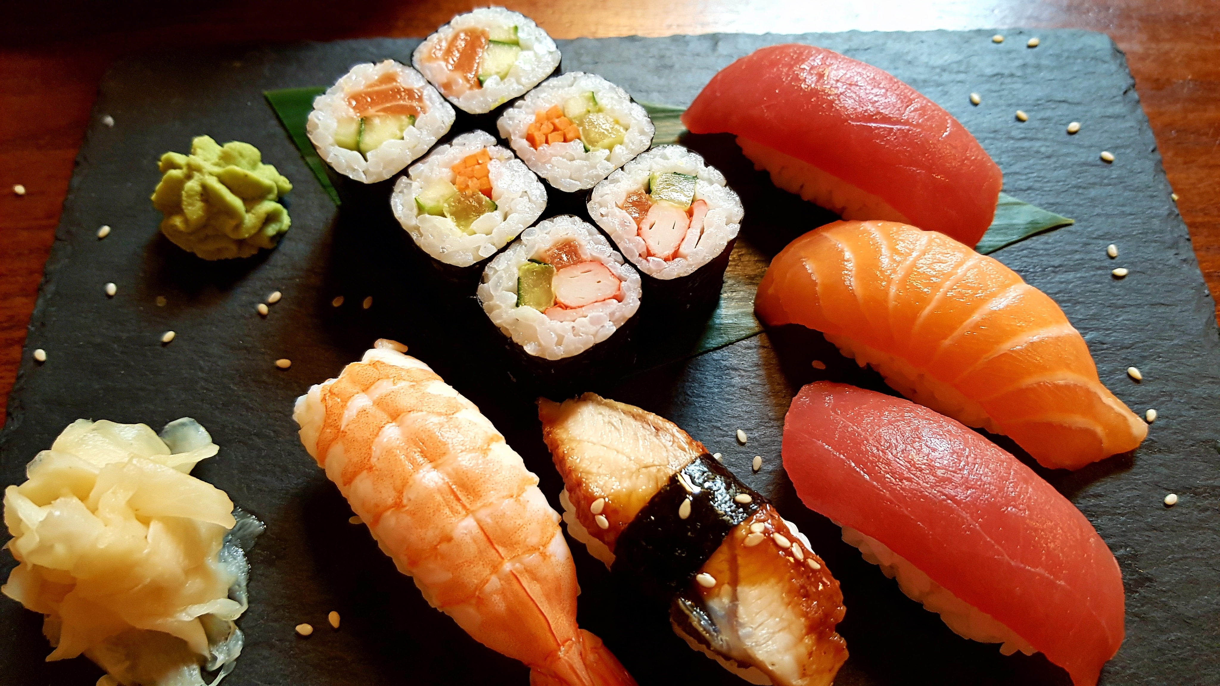 Fresh Sushi Platter on Dark Slate with Wasabi and Ginger
